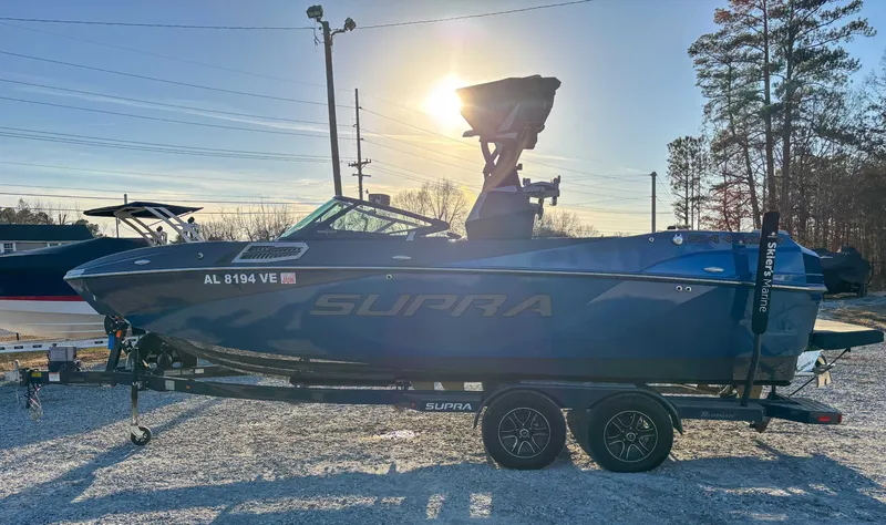 Slide: The Image of 2020 Supra SA450 boat on trailer at sunset. - 6