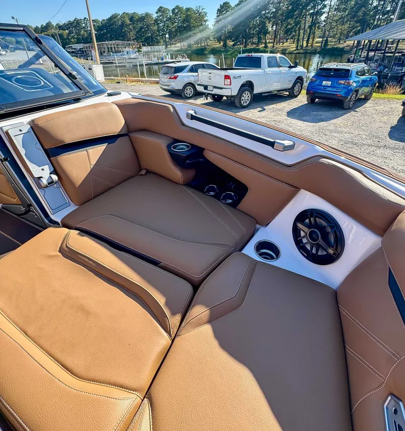 Slide: The Image of Interior of a 2023 Supra SL with brown leather seats. - 13
