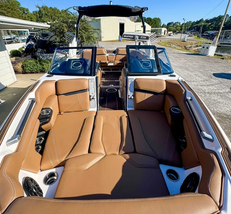 Slide: The Image of Interior of 2023 Supra SL boat with brown leather seats. - 15