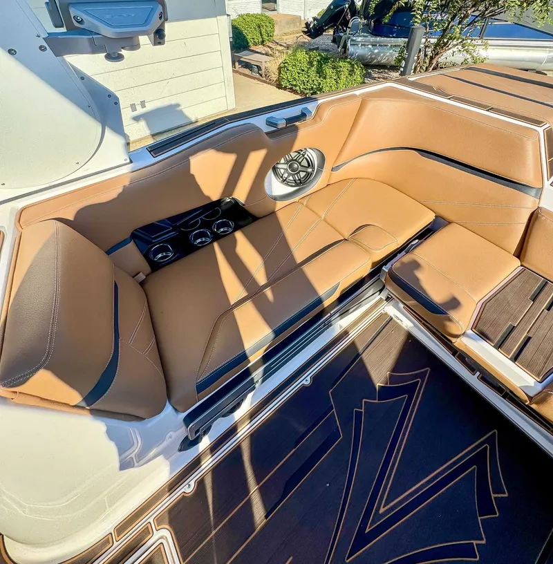 Slide: The Image of Luxurious interior of 2023 Supra SL with brown leather seating. - 19