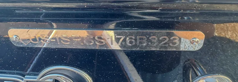 Slide: The Image of Metal plate with serial number on a 2023 Supra SL. - 23