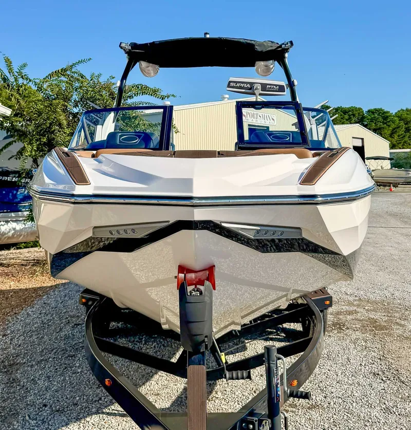 Slide: The Image of 2023 Supra SL boat on trailer, front view. - 4