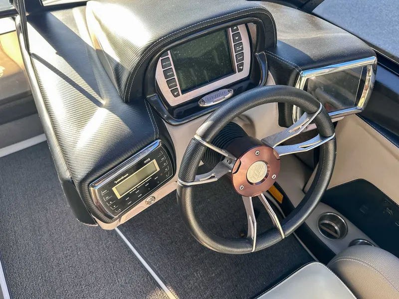 Slide: The Image of Interior of 2013 Malibu Wakesetter 20 VTX with steering wheel and dashboard. - 19
