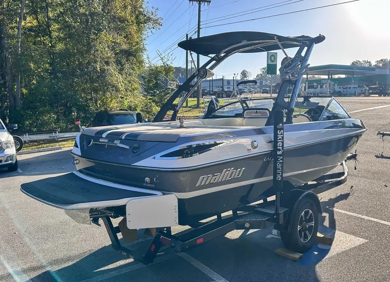 Slide: The Image of 2013 Malibu Wakesetter 20 VTX boat on trailer outdoors. - 6
