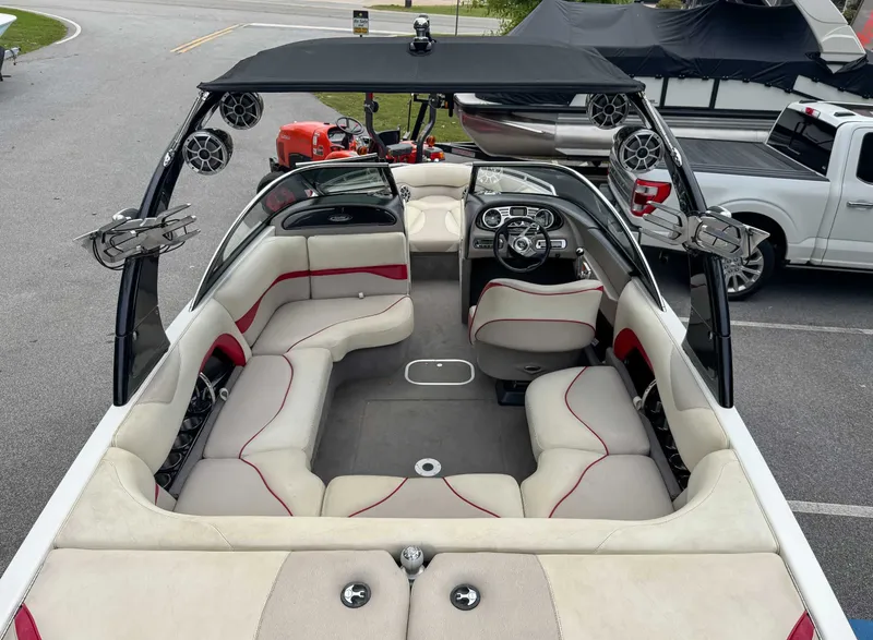 Slide: The Image of Interior of a 2008 Malibu Wakesetter 21 VLX boat with seating and speakers. - 11