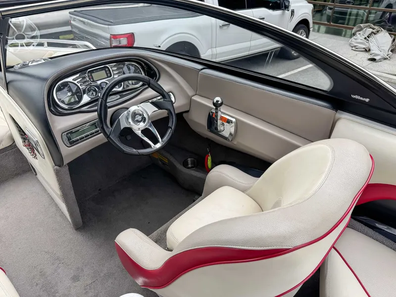 Slide: The Image of Interior of a 2008 Malibu Wakesetter 21 VLX boat with steering console. - 15