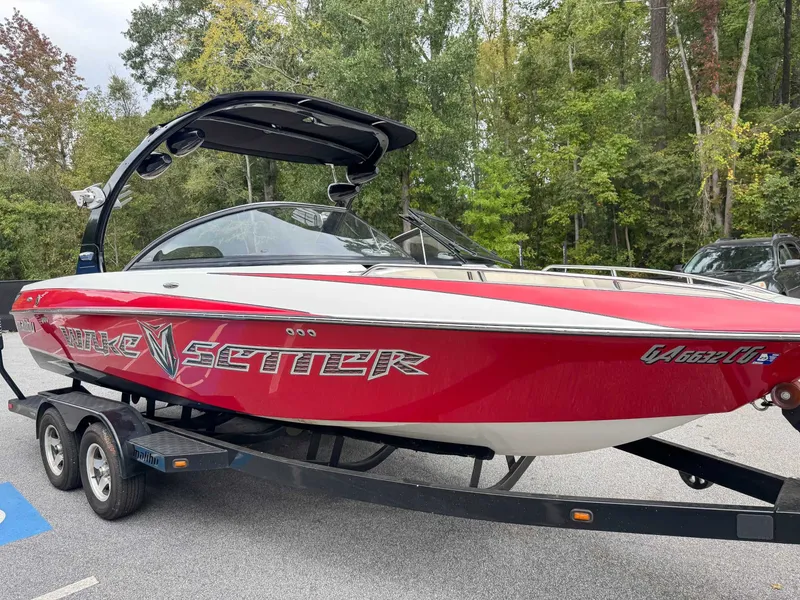 Slide: The Image of 2008 Malibu Wakesetter 21 VLX boat on trailer outdoors. - 3