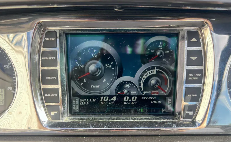 Slide: The Image of Dashboard of 2011 Malibu Wakesetter 23 LSV with digital displays. - 19