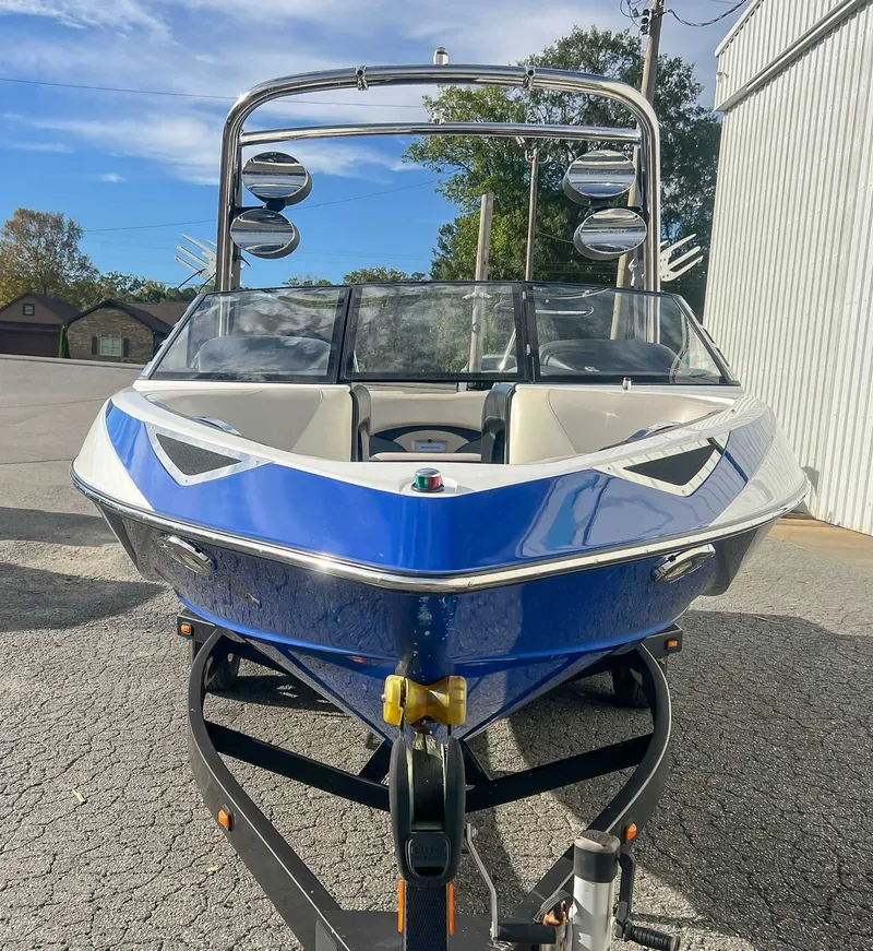 Slide: The Image of 2011 Malibu Wakesetter 23 LSV boat in blue on trailer. - 4
