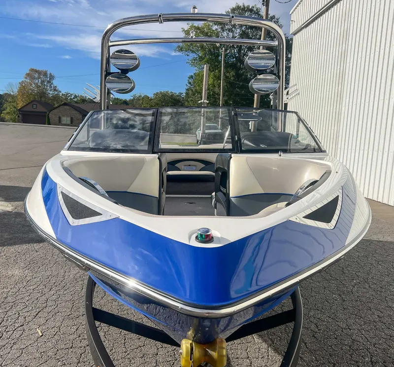 Slide: The Image of 2011 Malibu Wakesetter 23 LSV boat, blue and white, on trailer. - 5