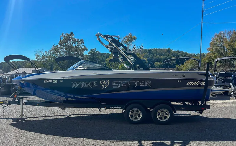 Slide: The Image of 2011 Malibu Wakesetter 23 LSV boat on trailer, blue sky. - 7