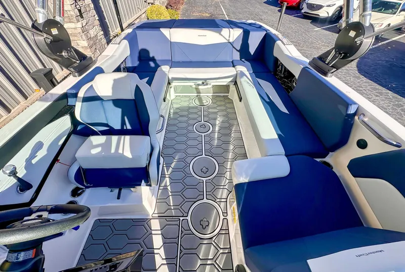 Slide: The Image of Interior of a 2021 MasterCraft NXT22 boat with blue seating. - 11