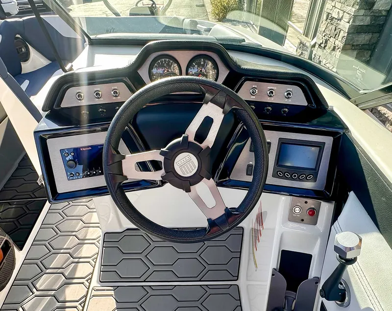 Slide: The Image of 2021 MasterCraft NXT22 boat steering console with modern instruments. - 14