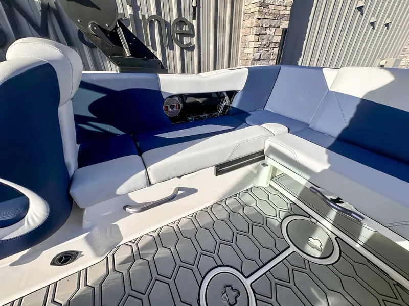 Slide: The Image of Interior of a 2021 MasterCraft NXT22 boat with blue seating. - 15