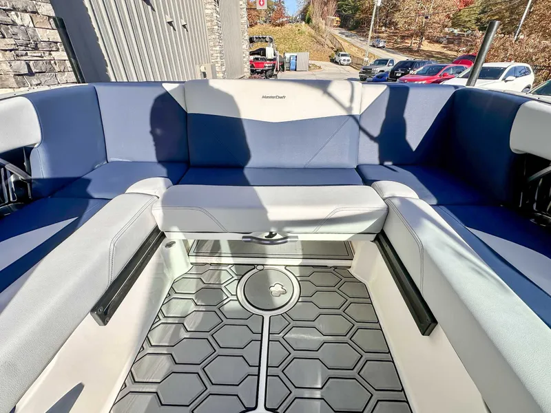 Slide: The Image of Interior of a 2021 MasterCraft NXT22 boat with blue seating. - 16