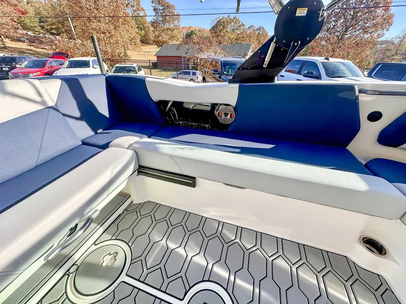 Slide: The Image of Interior of a 2021 MasterCraft NXT22 boat with blue seating. - 17