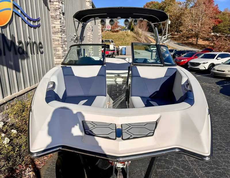 Slide: The Image of 2021 MasterCraft NXT22 boat displayed outdoors. - 4