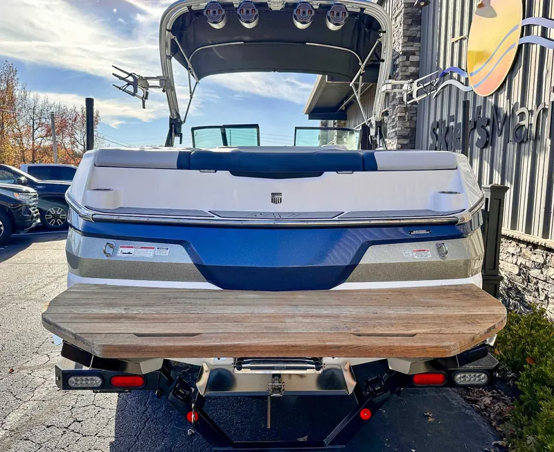 Slide: The Image of Rear view of a 2021 MasterCraft NXT22 boat on a trailer. - 6