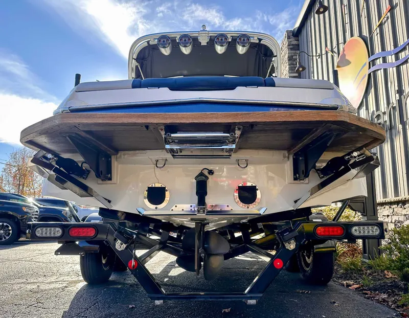 Slide: The Image of Rear view of a 2021 MasterCraft NXT22 boat on a trailer. - 7