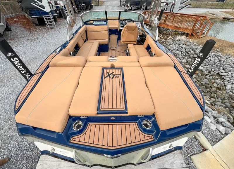 Slide: The Image of 2021 MasterCraft XT22 boat with luxurious interior and teak accents. - 10