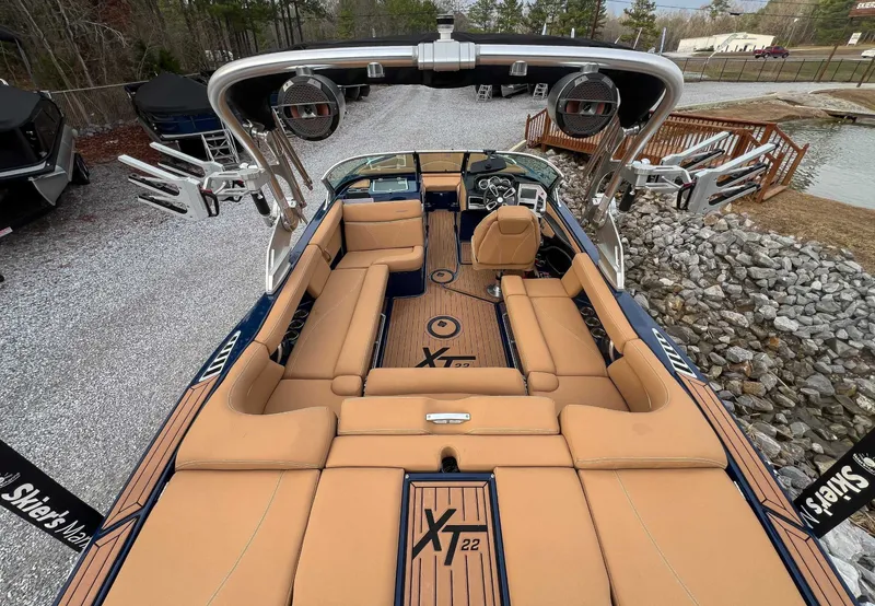 Slide: The Image of Interior view of a 2021 MasterCraft XT22 boat with luxurious seating. - 11