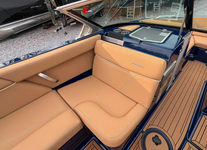 Slide: The Image of Interior of a 2021 MasterCraft XT22 with beige seating. - 15