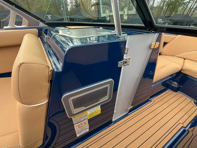 Slide: The Image of Interior of a 2021 MasterCraft XT22 with blue and beige seating. - 16
