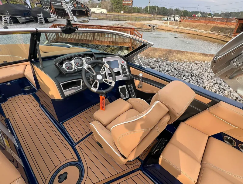 Slide: The Image of Interior of a 2021 MasterCraft XT22 boat with luxurious seating. - 17