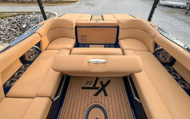 Slide: The Image of Interior of a 2021 MasterCraft XT22 with beige seating. - 20