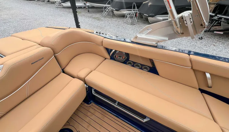 Slide: The Image of Interior of a 2021 MasterCraft XT22 with beige leather seating. - 21