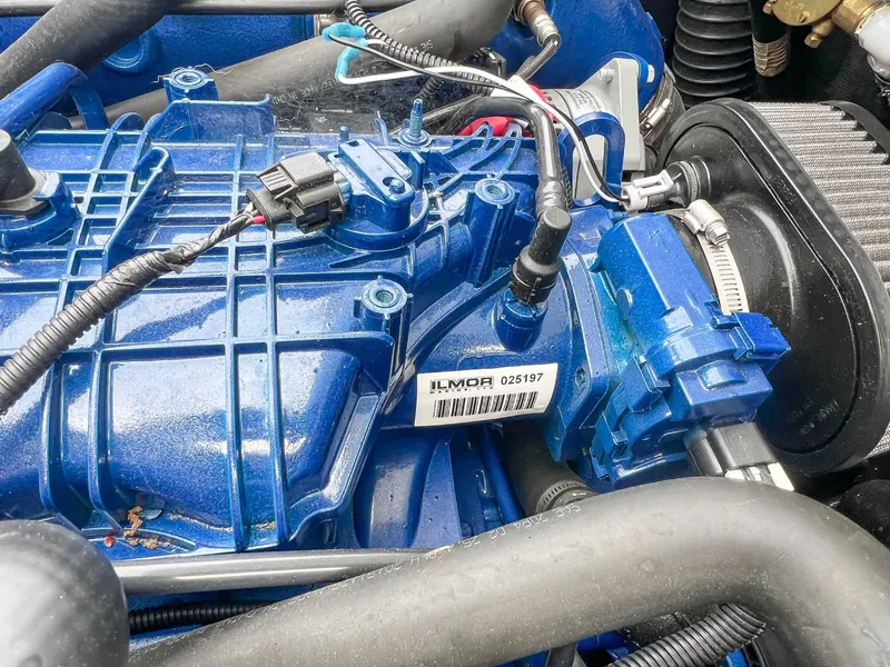 Slide: The Image of Engine of 2021 MasterCraft XT22 with blue cover. - 23