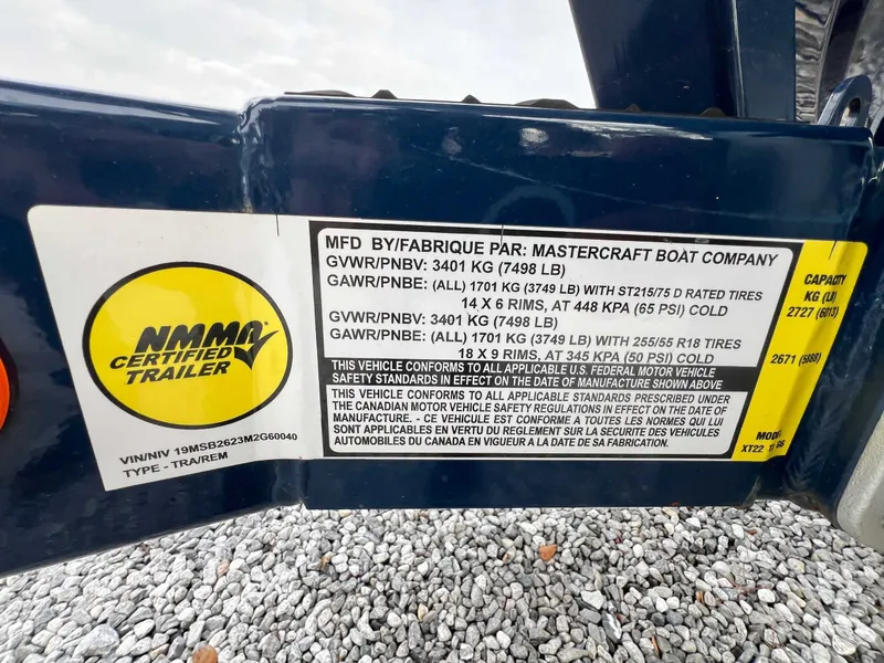Slide: The Image of MasterCraft XT22 2021 trailer label with technical specifications. - 25