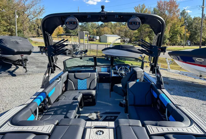 Slide: The Image of Interior view of 2024 MasterCraft XT24 boat with blue accents. - 12