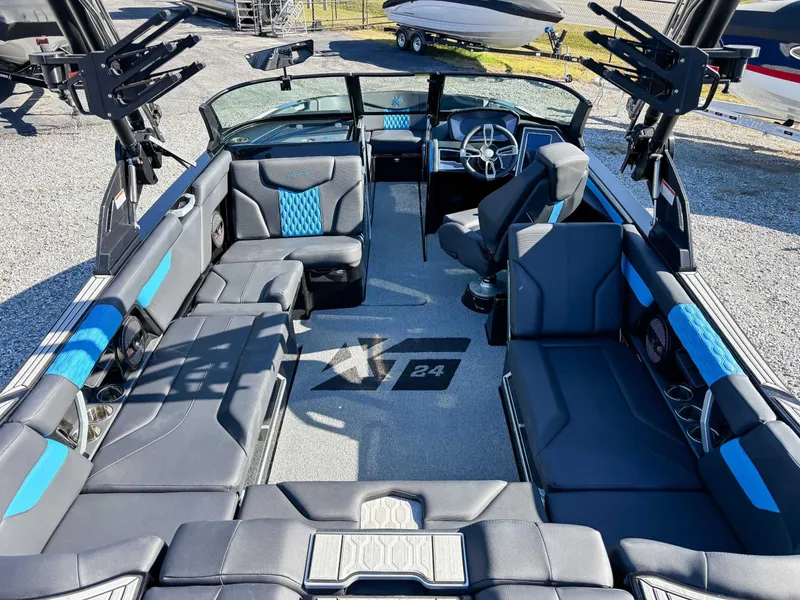 Slide: The Image of Interior of 2024 MasterCraft XT24 boat with luxurious features. - 14