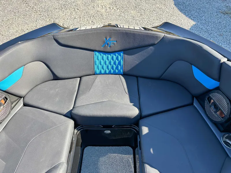 Slide: The Image of 2024 MasterCraft XT24 interior with blue accents. - 16
