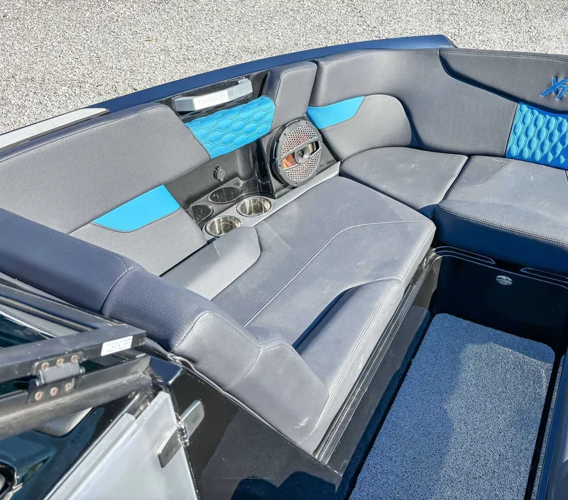 Slide: The Image of Interior of 2024 MasterCraft XT24 with blue accents. - 17