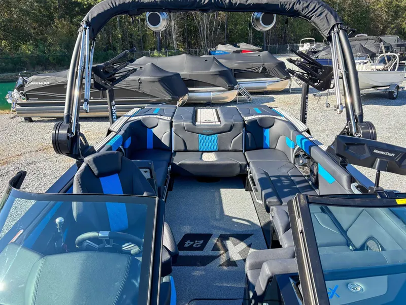 Slide: The Image of Interior of 2024 MasterCraft XT24 boat with blue accents. - 19