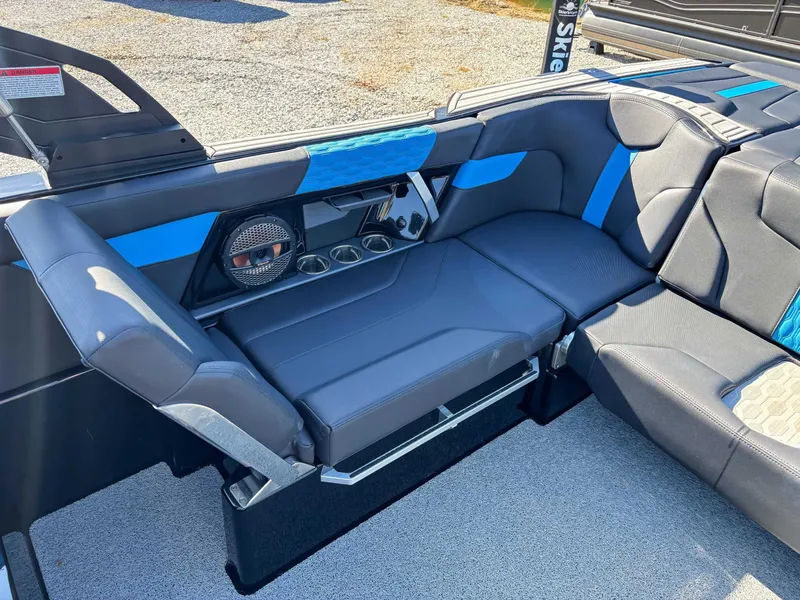 Slide: The Image of Interior of 2024 MasterCraft XT24 with blue accents and speakers. - 24