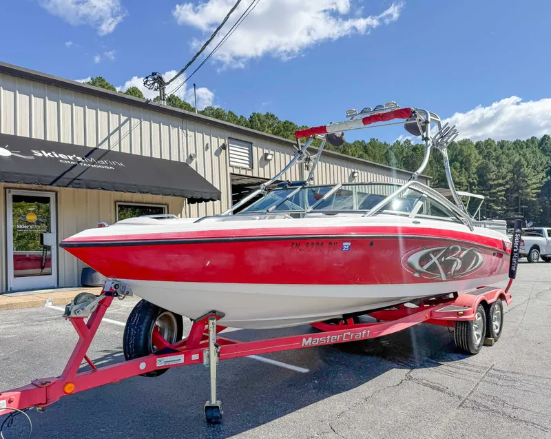 Slide: The Image of 2002 MasterCraft X30 boat on trailer outside Skier's Marine. - 3
