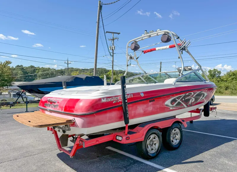 Slide: The Image of 2002 MasterCraft X30 boat on trailer, sunny day. - 7