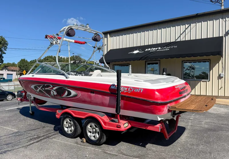 Slide: The Image of Red 2002 MasterCraft X30 boat outside Skier's Marine. - 8