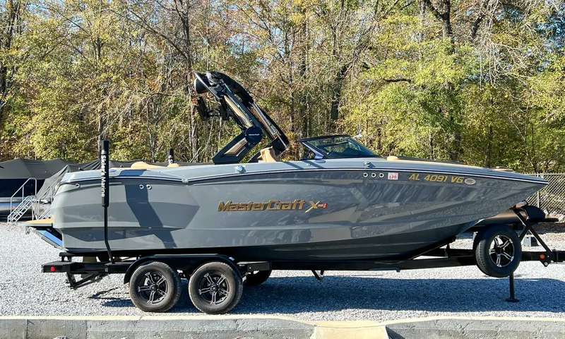 The Image of 2024 MasterCraft XStarS boat parked on trailer outdoors. - 1