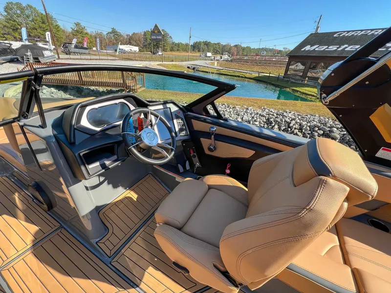 Slide: The Image of 2024 MasterCraft XStarS interior with luxurious seating and modern cockpit. - 14