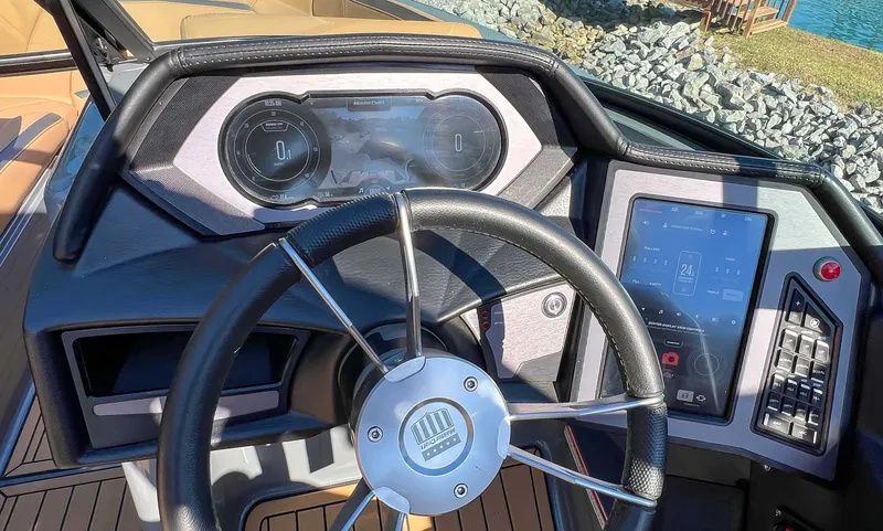 Slide: The Image of Dashboard of 2024 MasterCraft XStarS with steering wheel and touchscreen. - 16