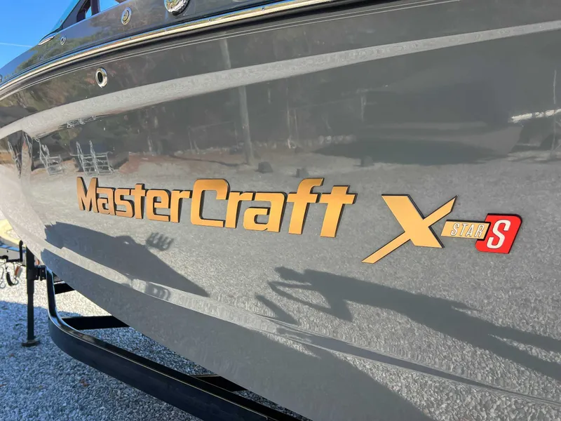 Slide: The Image of 2024 MasterCraft XStarS boat, side view with logo. - 23