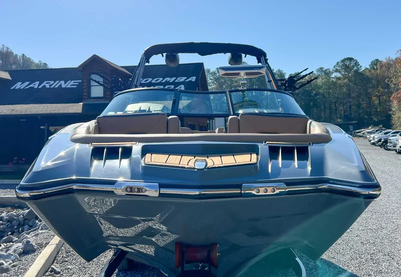 Slide: The Image of 2024 MasterCraft XStarS boat in front of a building. - 4