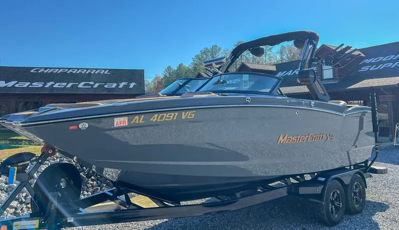 Slide: The Image of 2024 MasterCraft XStarS boat on trailer, sunny day. - 5