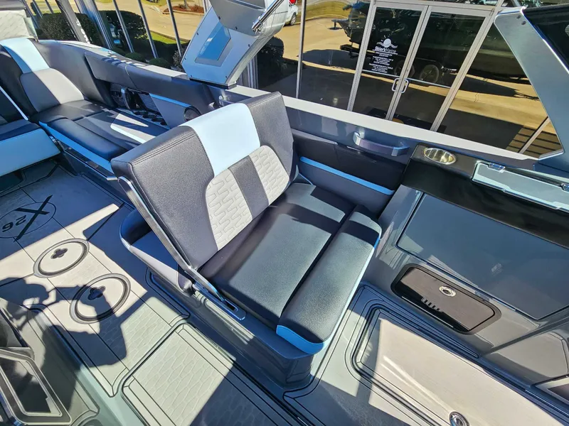 Slide: The Image of Interior of 2023 MasterCraft X26 boat with luxurious seating. - 11