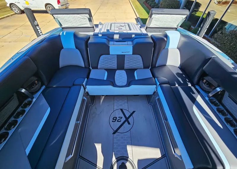 Slide: The Image of Interior of 2023 MasterCraft X26 boat with luxurious seating arrangement. - 17