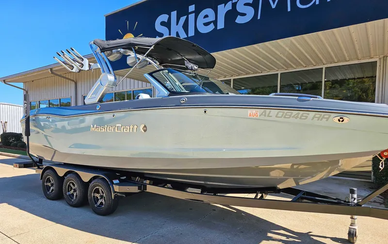 Slide: The Image of 2023 MasterCraft X26 boat on trailer at Skier's Marine. - 3
